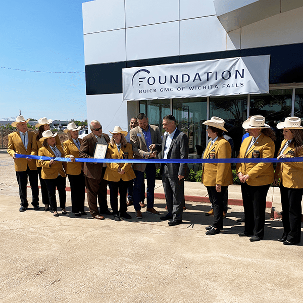 A Group of People Gathered for a Ribbon Cutting