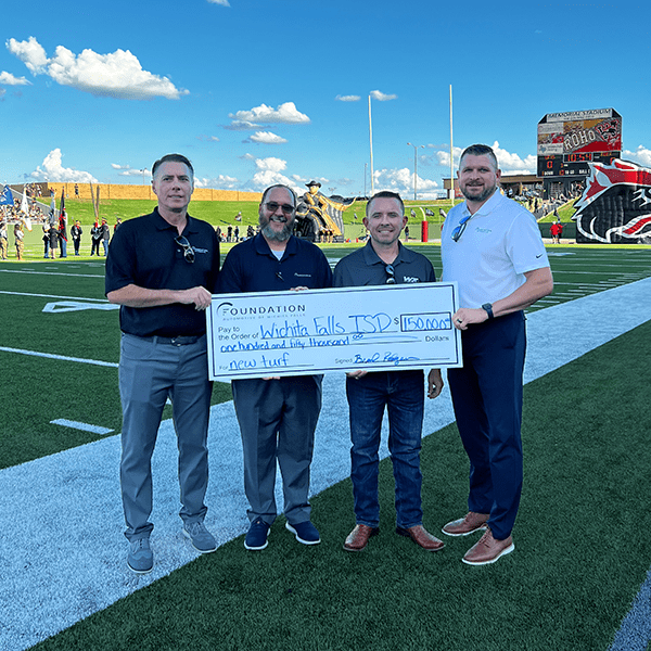 A Group of People Handing Over a Cheque