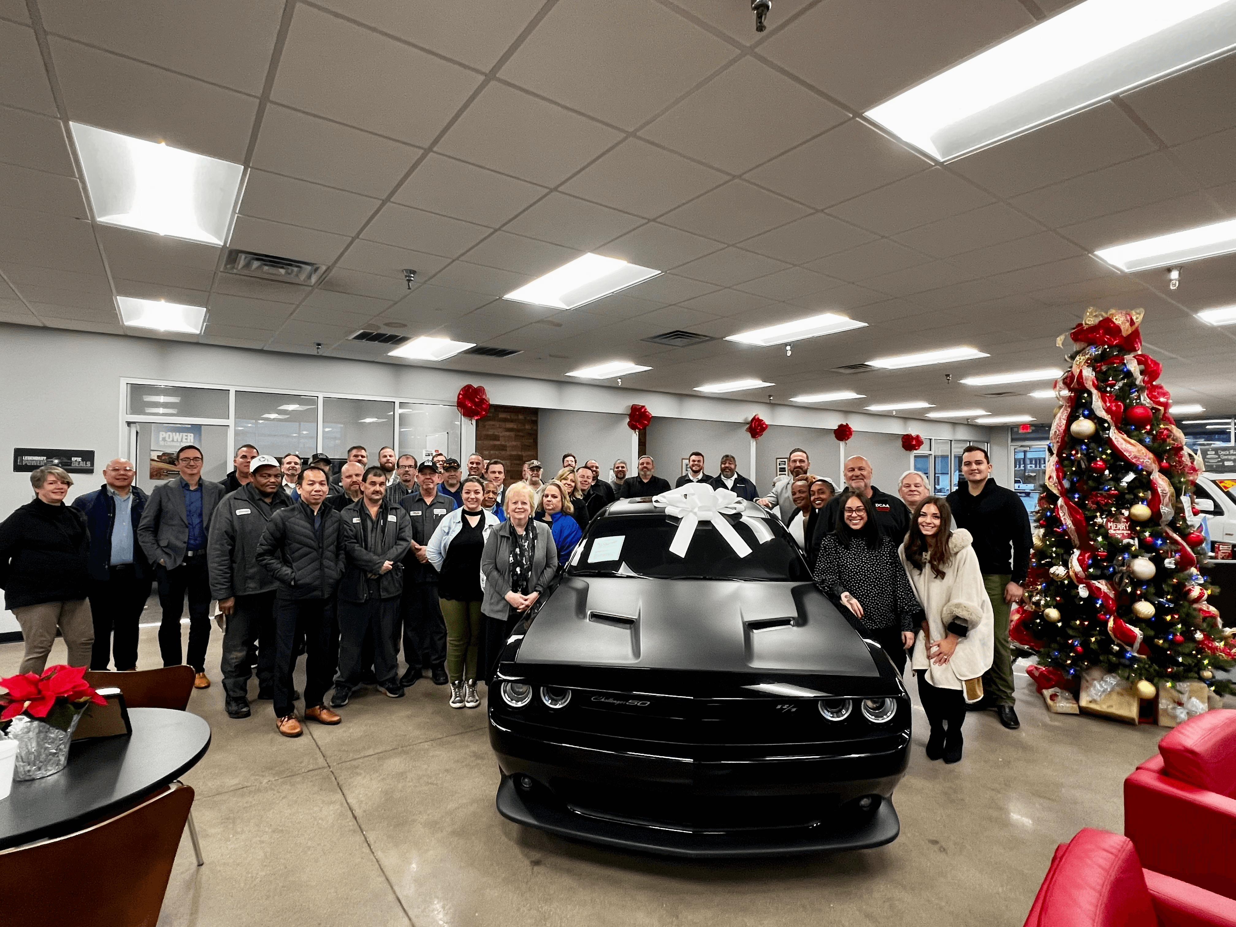 A Black Color Mustang With a Group of People